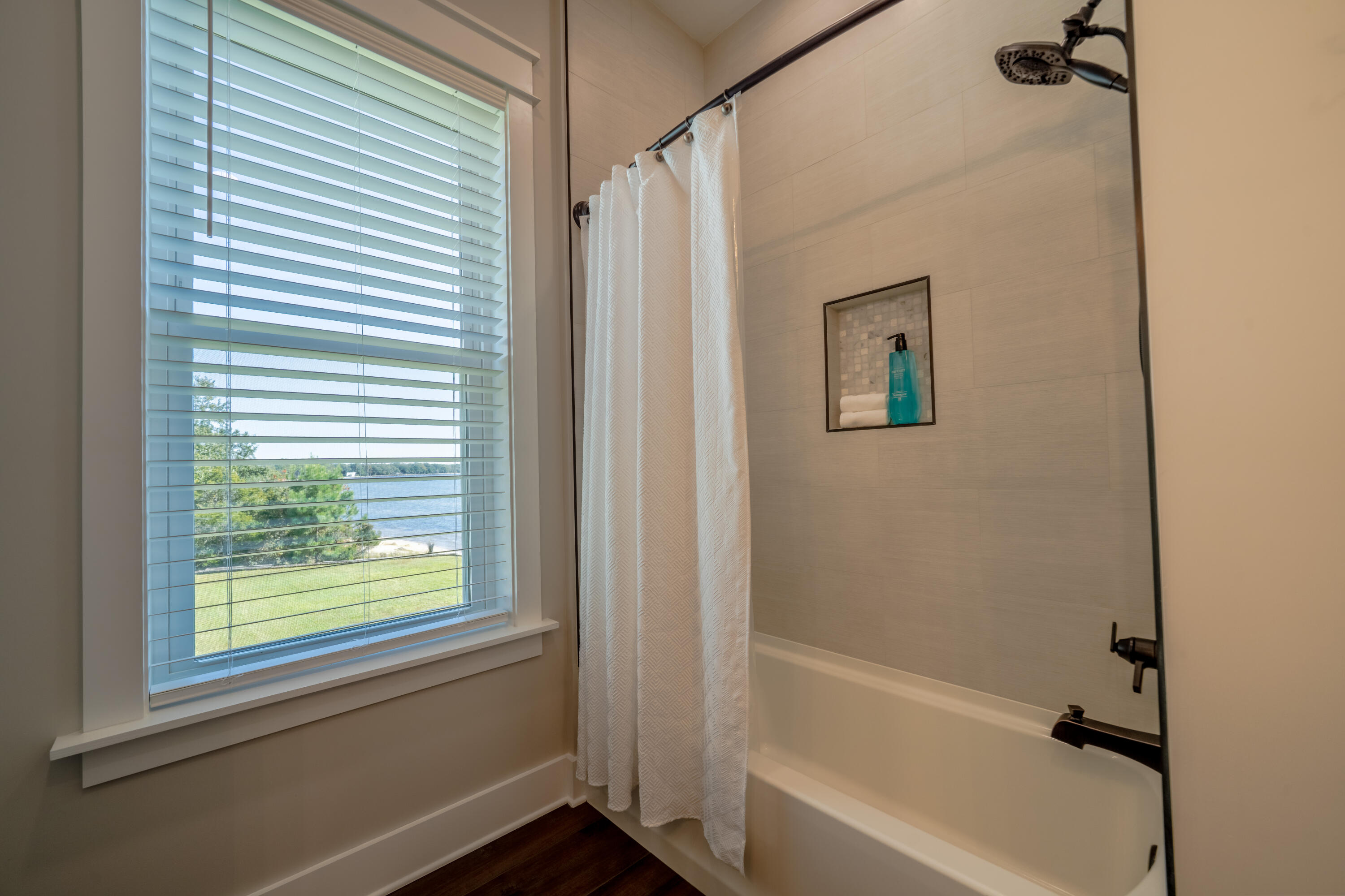 68 Dolphin Place Freeport, FL 32439 - Photo 67 of 118 a bathroom with a bathtub and a shower