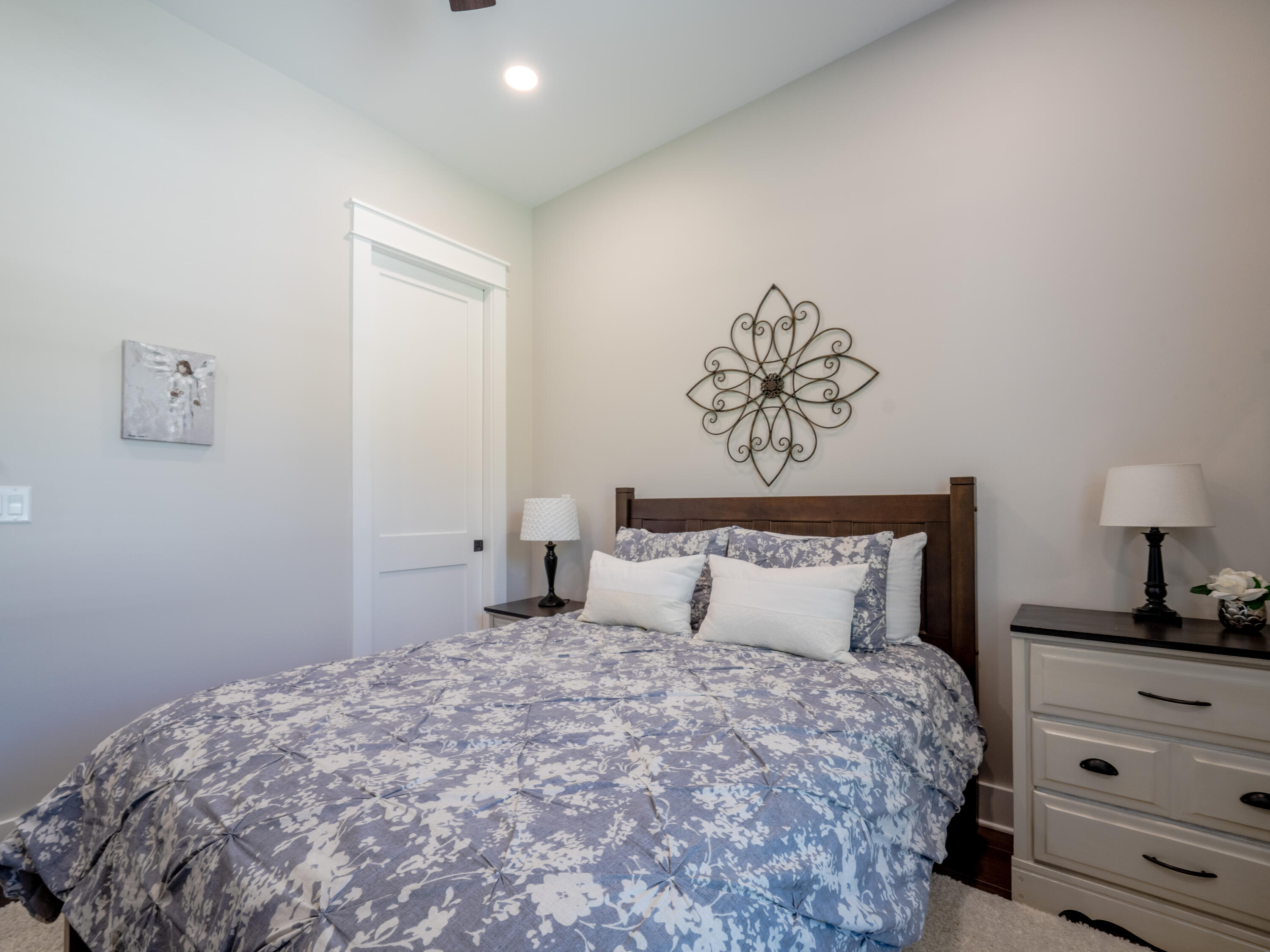 68 Dolphin Place Freeport, FL 32439 - Photo 69 of 118 a bedroom with a bed and a lamp on dresser