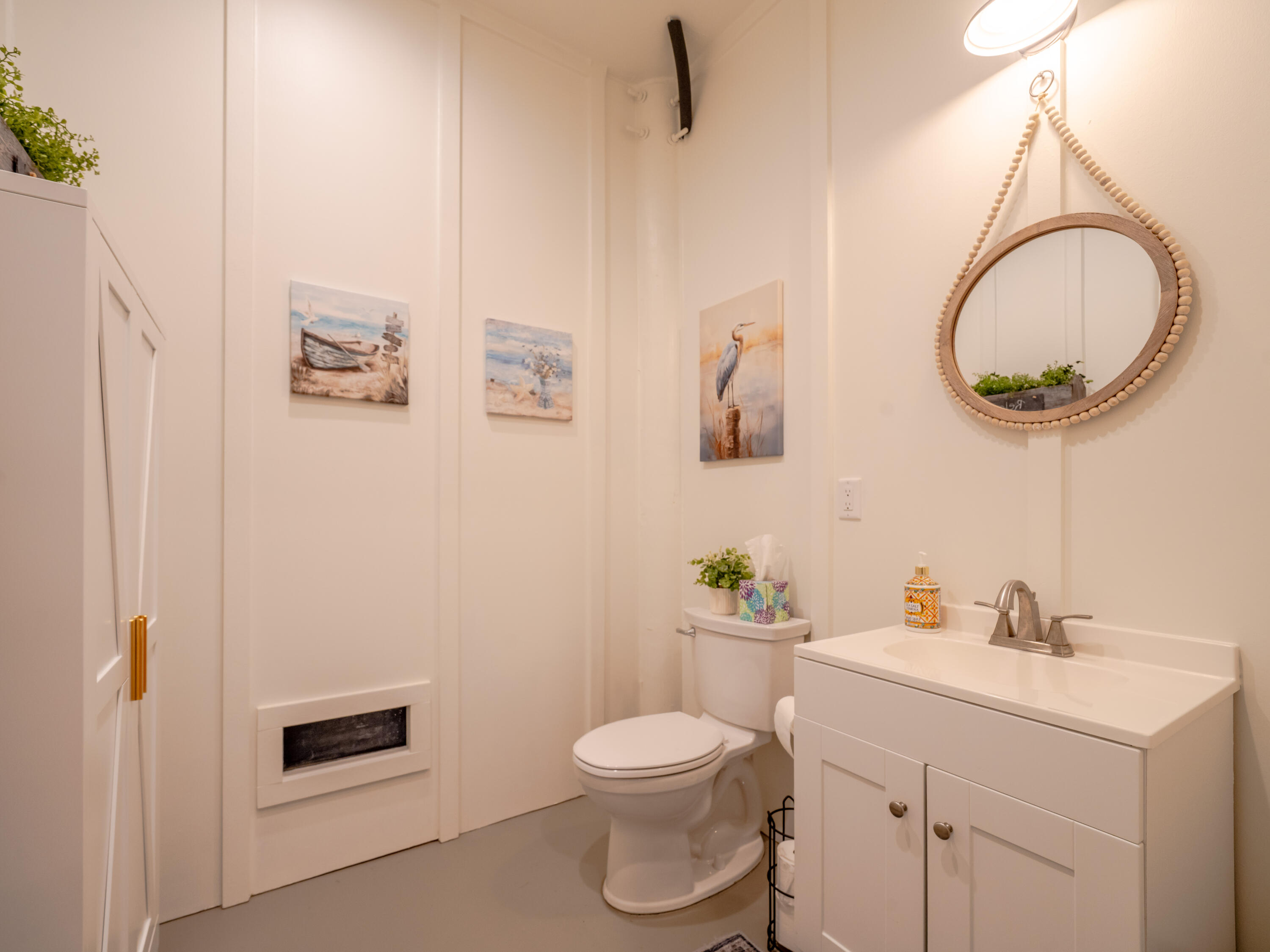 68 Dolphin Place Freeport, FL 32439 - Photo 87 of 118 a bathroom with a toilet a sink and mirror