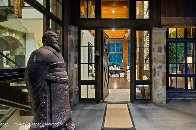 an aerial view of a house with table and chairs