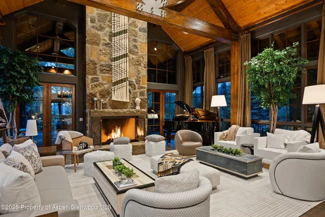 a view of backyard with seating area and green space