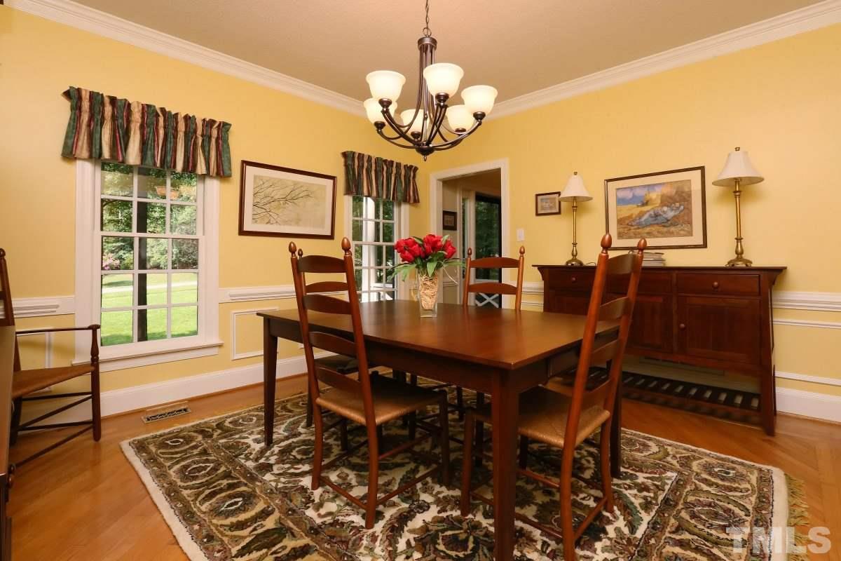 12020 Deer Run Raleigh, NC 27614 - Photo 14 of 25 a view of a dining room with furniture and chandelier