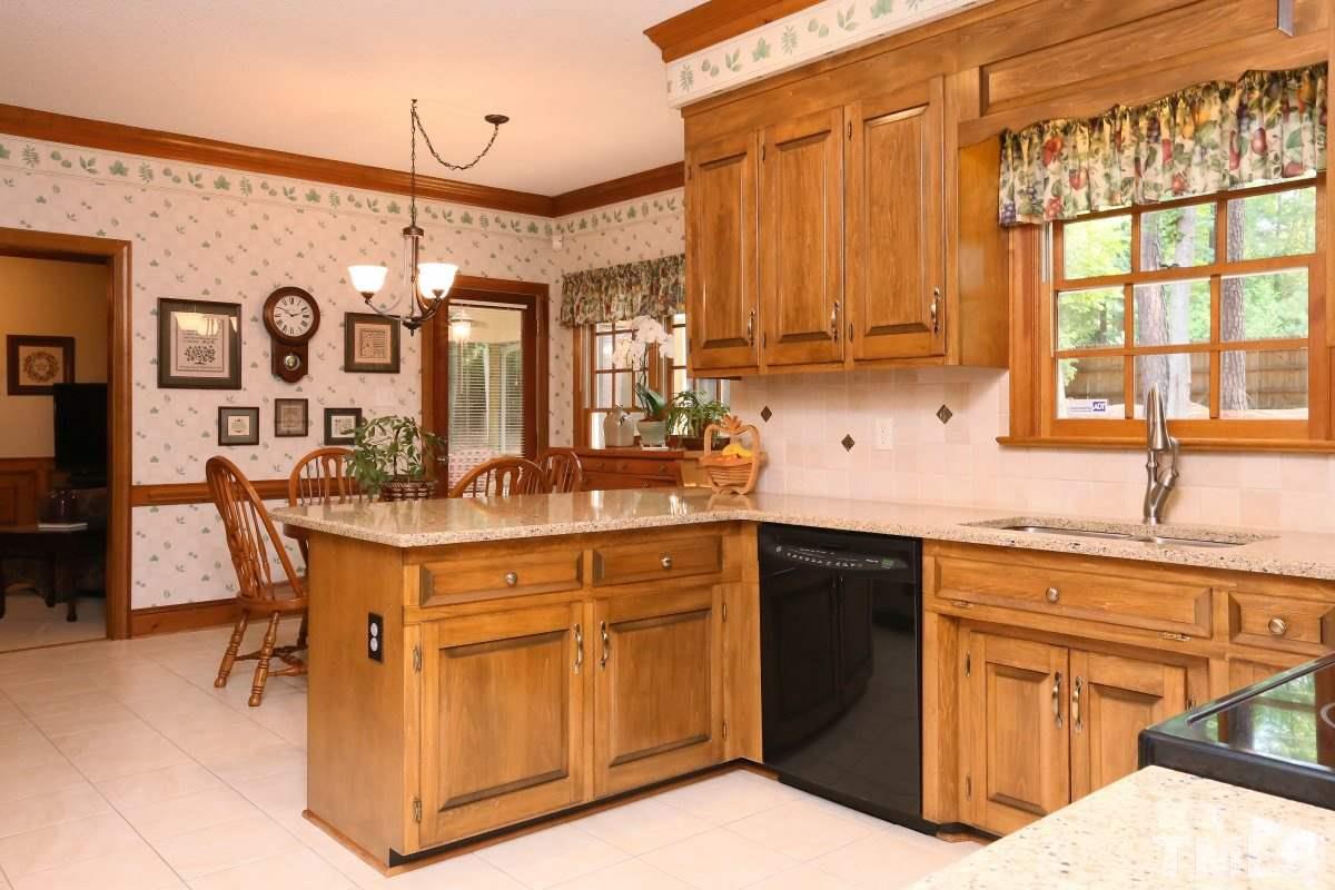 12020 Deer Run Raleigh, NC 27614 - Photo 8 of 25 a kitchen with a sink cabinets and appliances