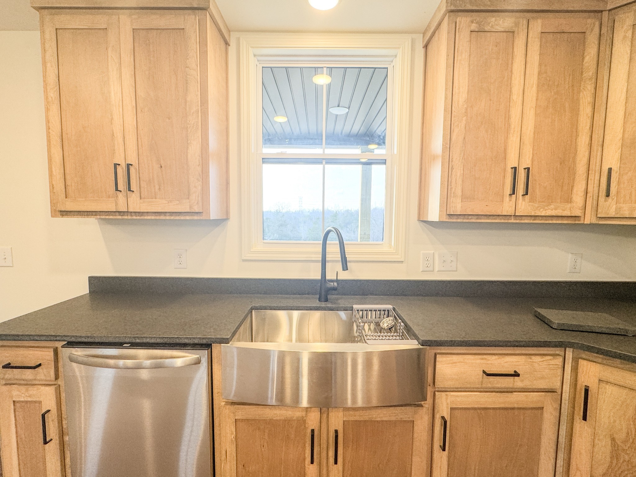 517 Pleasant Hill Road Lafayette, TN 37083 - Photo 12 of 39 a kitchen with granite countertop white cabinets and window