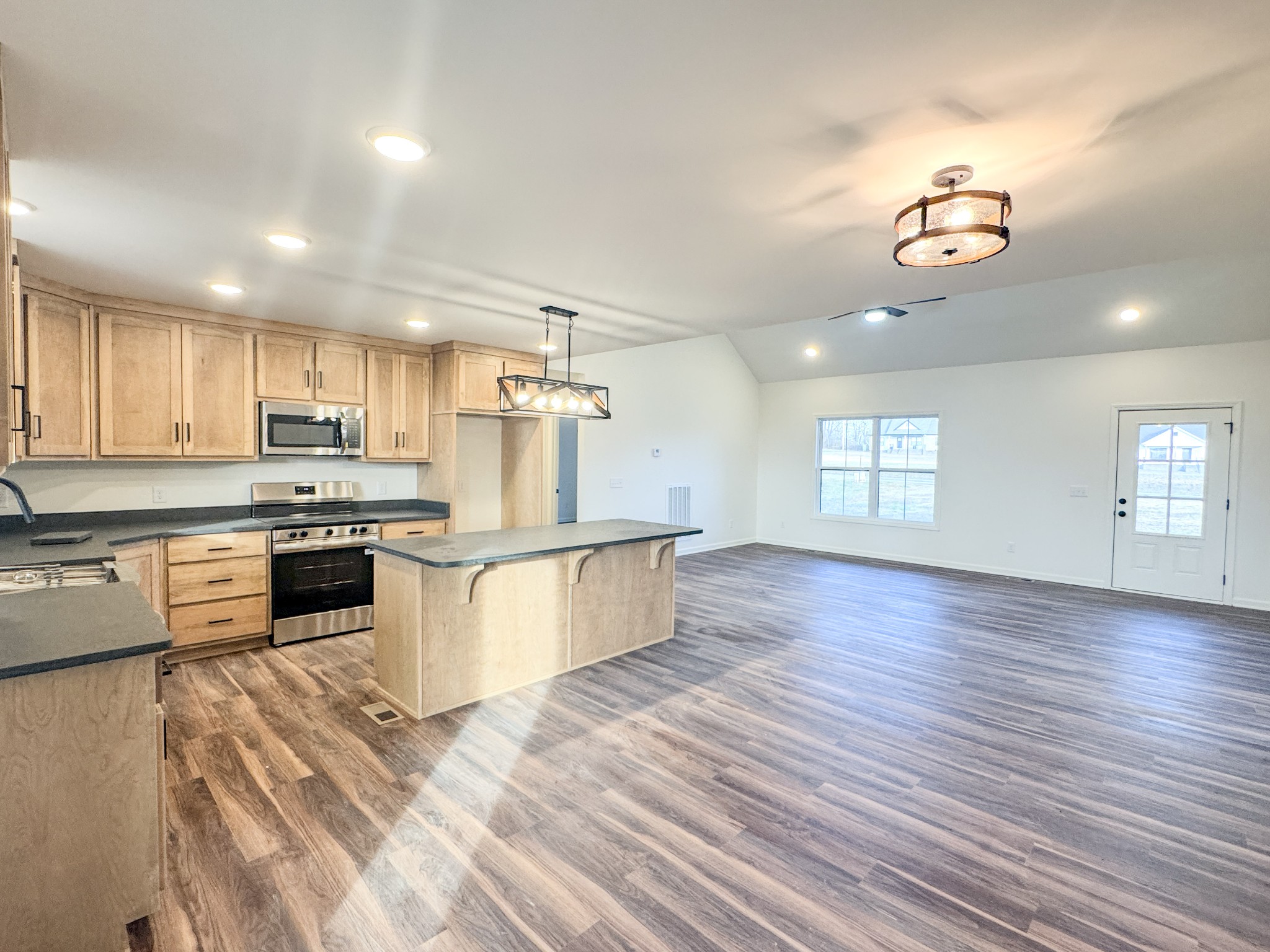 517 Pleasant Hill Road Lafayette, TN 37083 - Photo 14 of 39 a kitchen with a refrigerator and a stove top oven