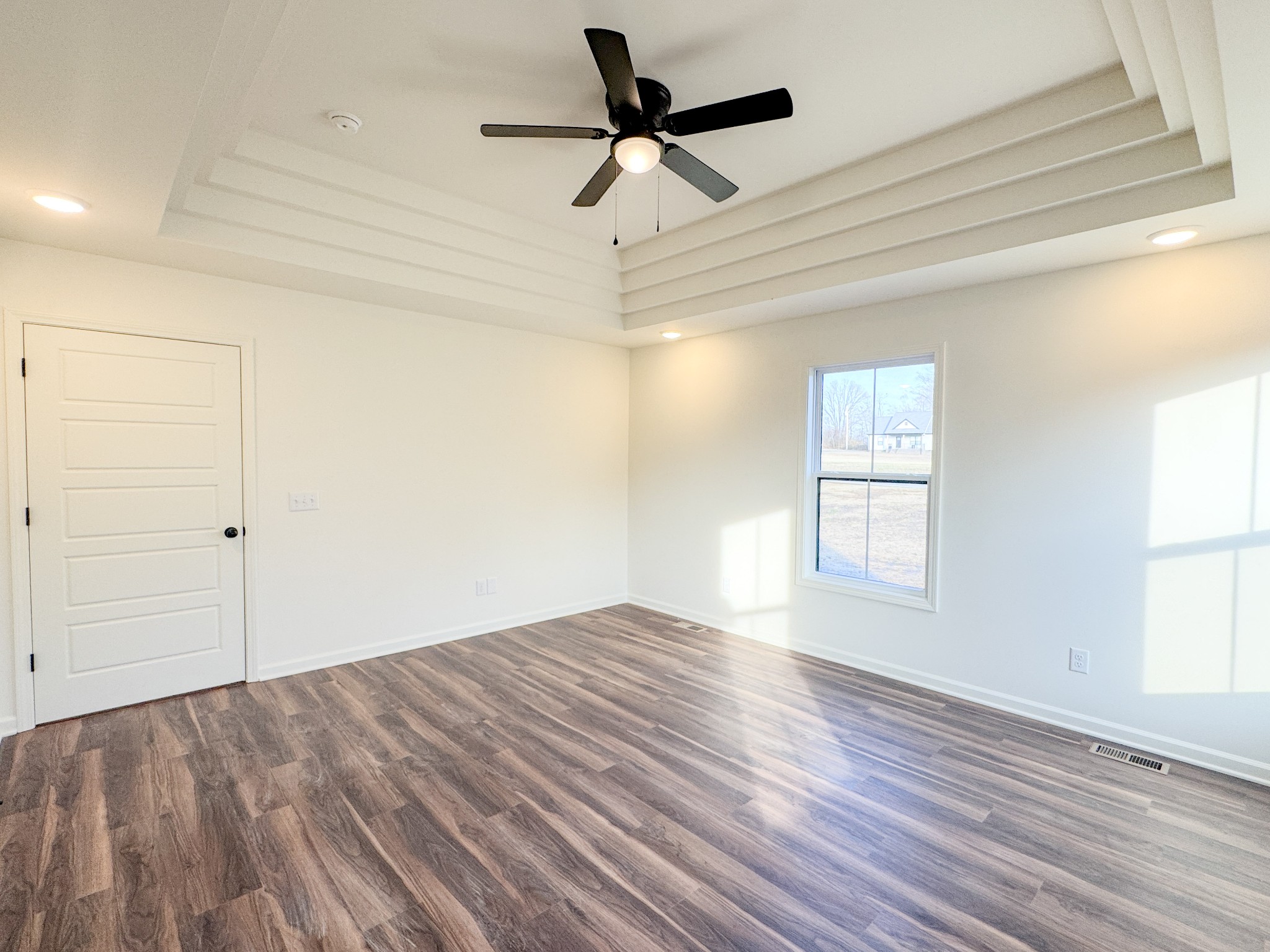 517 Pleasant Hill Road Lafayette, TN 37083 - Photo 15 of 39 a view of empty room with wooden floor and fan