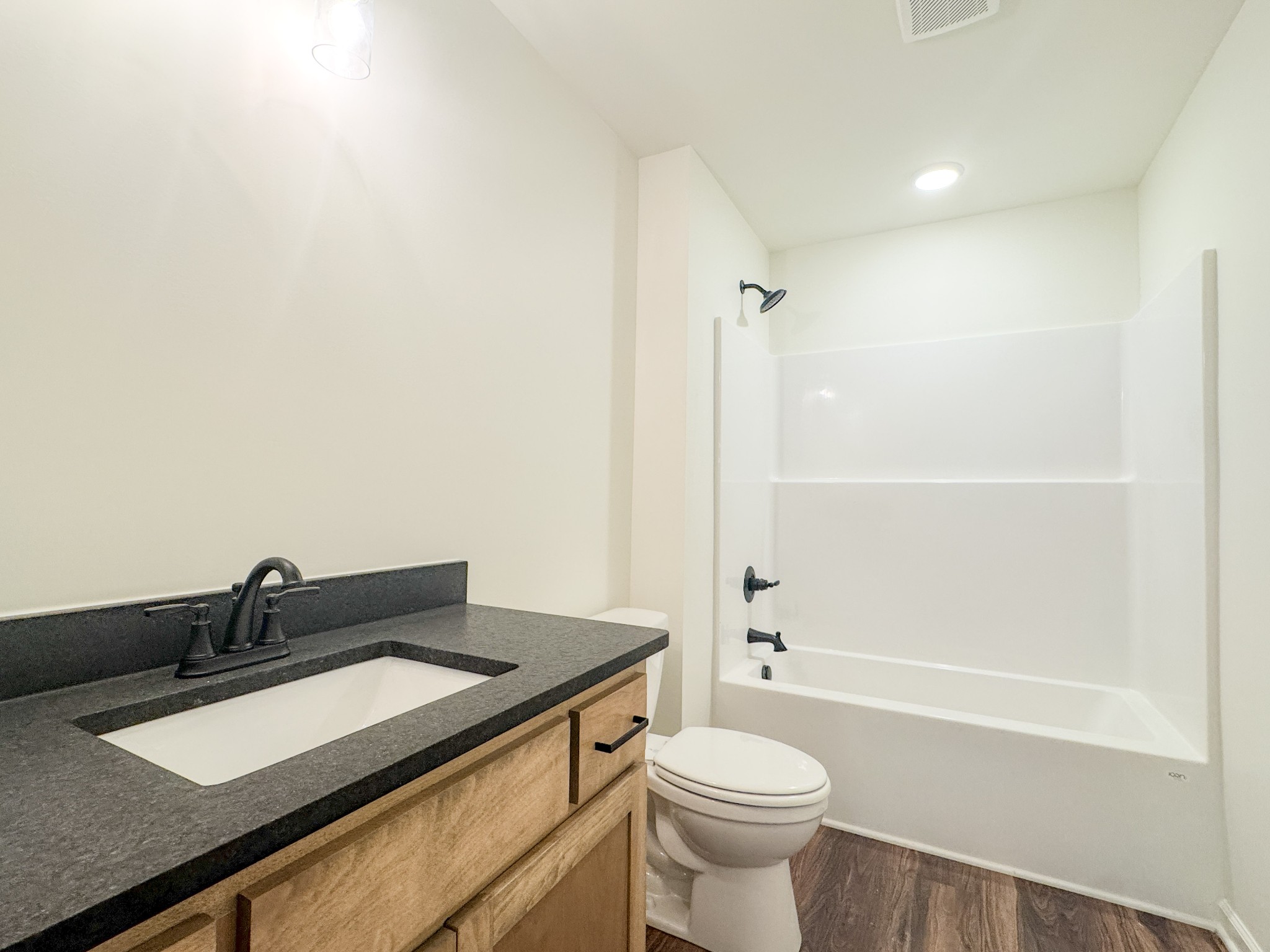 517 Pleasant Hill Road Lafayette, TN 37083 - Photo 23 of 39 a bathroom with a granite countertop sink toilet and shower