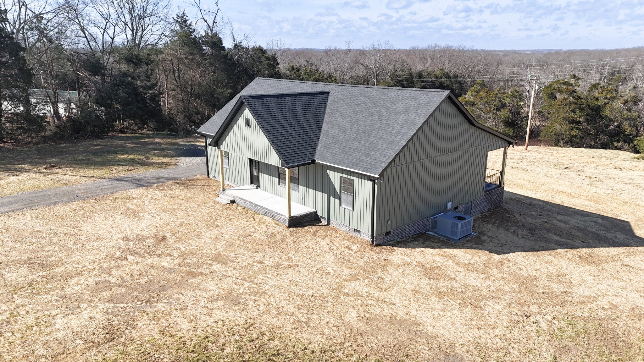 517 Pleasant Hill Road Lafayette, TN 37083 - Photo 31 of 39 a view of a house with a snow in the yard