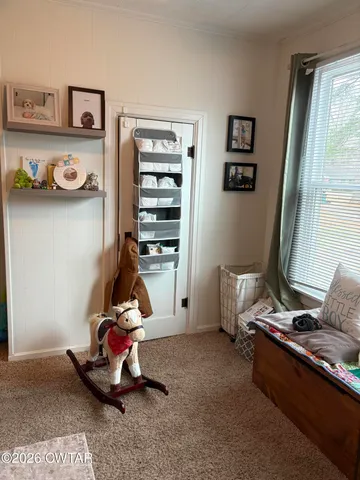 a room with gym equipment and a window