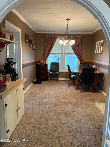 a room with furniture and a flat screen tv