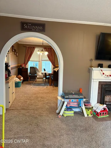 a room with furniture and a flat screen tv