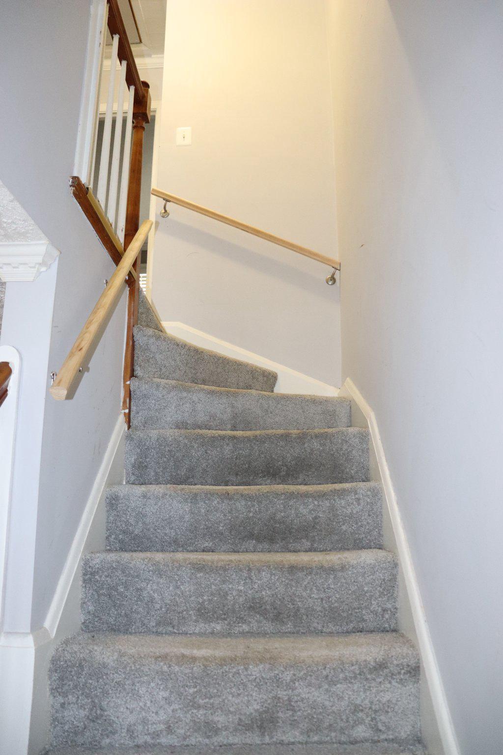 1328 Cedarcroft Road Baltimore, MD 21239 - Photo 18 of 39 Carpeted stairs with dual handrails for safety.