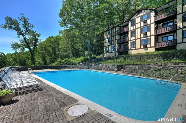 a view of a swimming pool with a yard