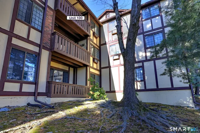 a view of a building with a yard