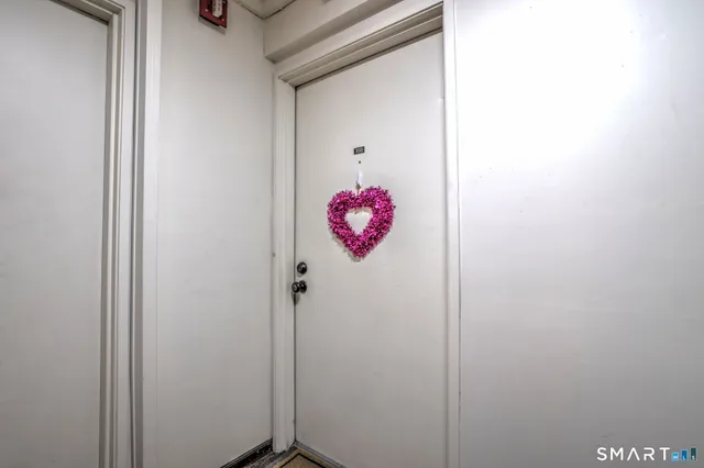a bathroom with a shower and a mirror
