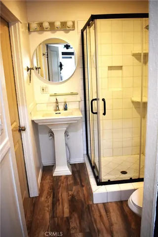 a bathroom with a sink toilet and shower