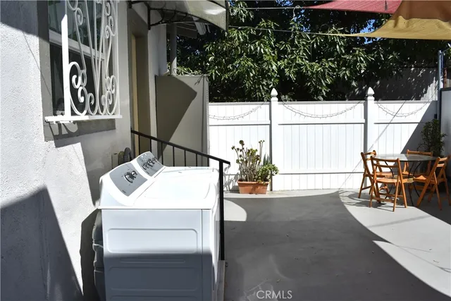 a room with a door open and a table