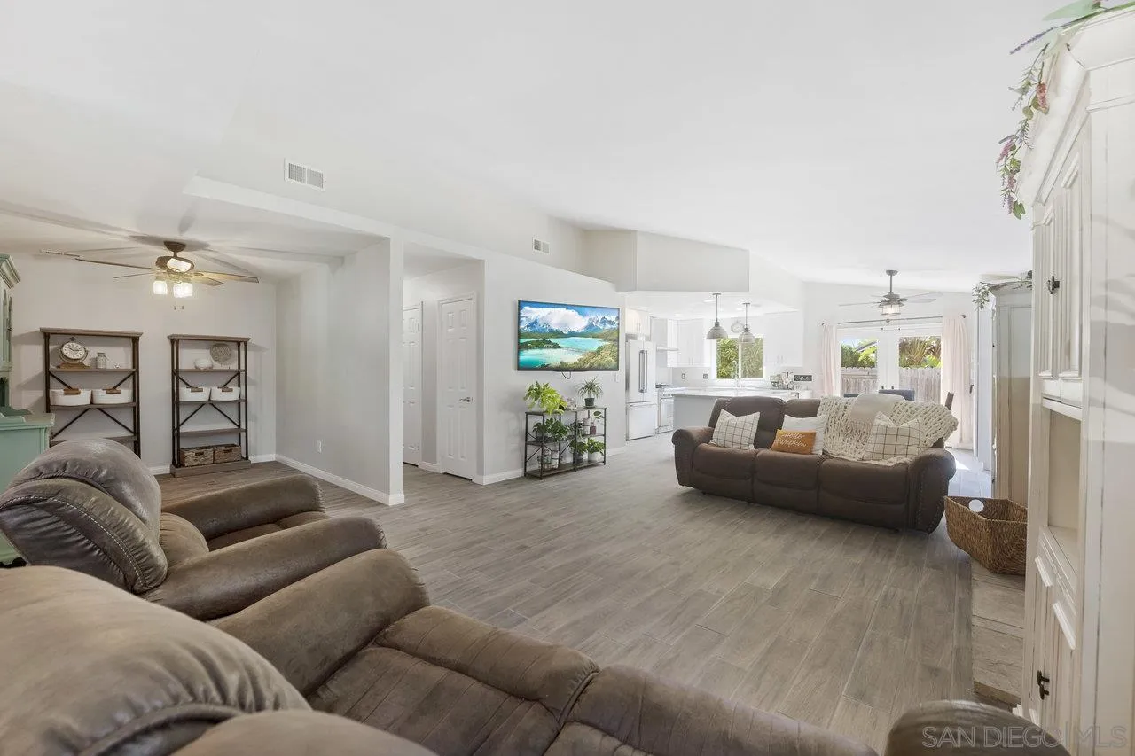 607 Maybritt Circle San Marcos, CA 92069 - Photo 11 of 38 a living room with furniture and a wooden floor