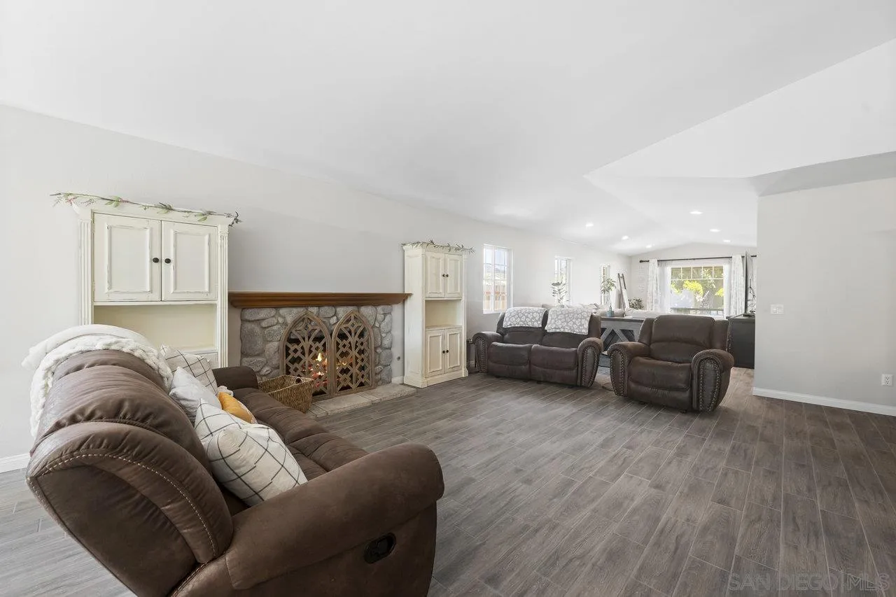 607 Maybritt Circle San Marcos, CA 92069 - Photo 12 of 38 a living room with furniture and a couch