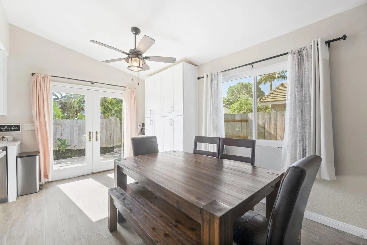 607 Maybritt Circle San Marcos, CA 92069 - Photo 15 of 38 a view of a dining room with furniture window and wooden floor