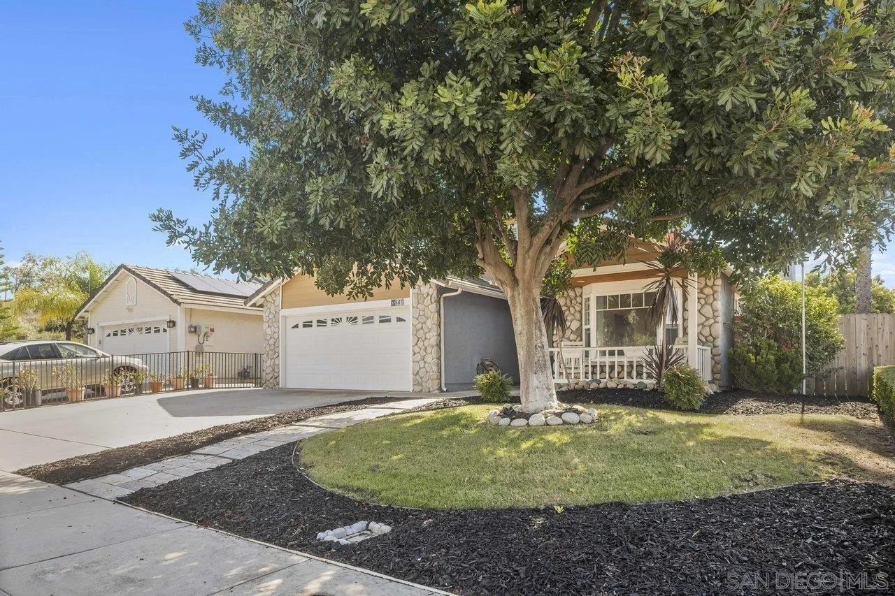 607 Maybritt Circle San Marcos, CA 92069 - Photo 2 of 38 a front view of a house with garden