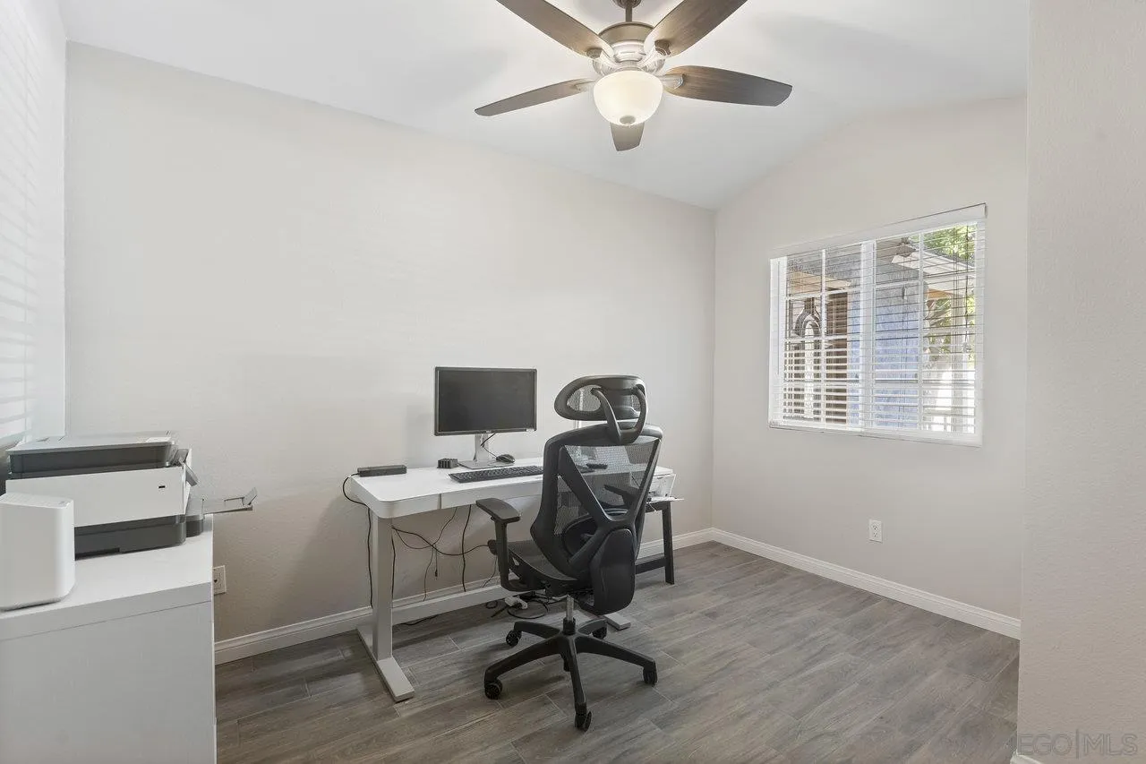 607 Maybritt Circle San Marcos, CA 92069 - Photo 23 of 38 a view of a workspace with furniture and a window