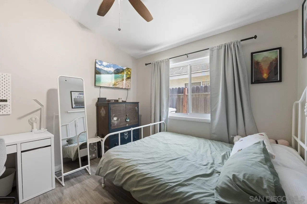 607 Maybritt Circle San Marcos, CA 92069 - Photo 24 of 38 a bedroom with a bed and a flat screen tv