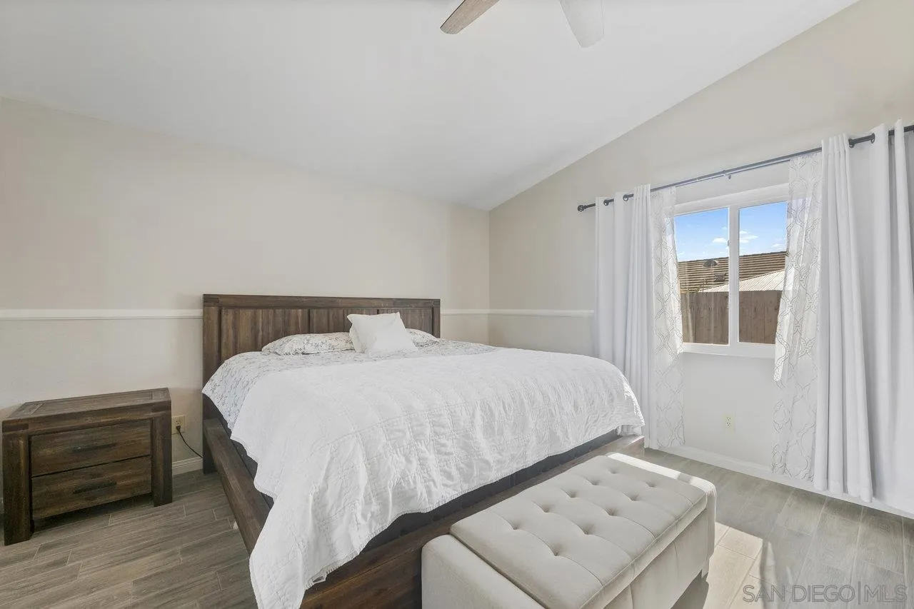 607 Maybritt Circle San Marcos, CA 92069 - Photo 30 of 38 a bedroom with a bed and a window