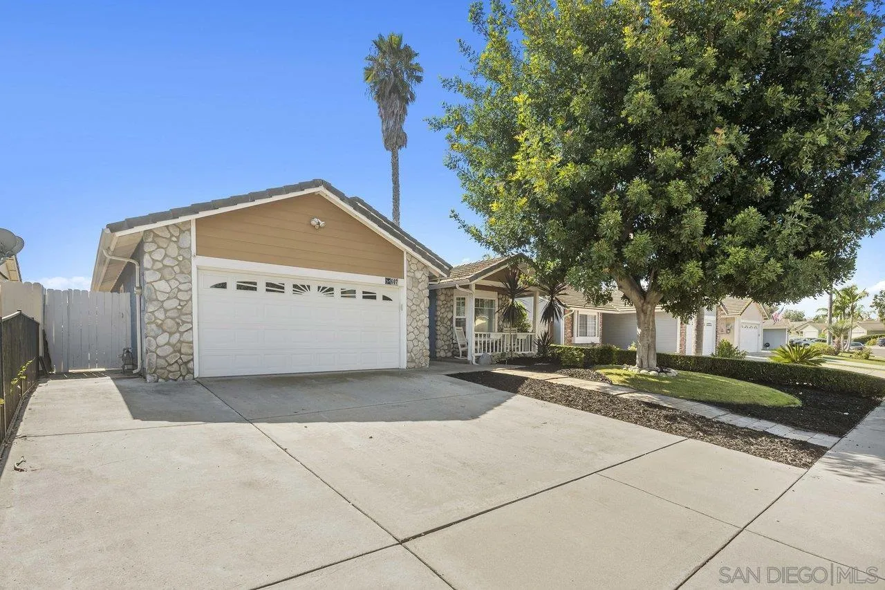 607 Maybritt Circle San Marcos, CA 92069 - Photo 5 of 38 a front view of a house with a yard