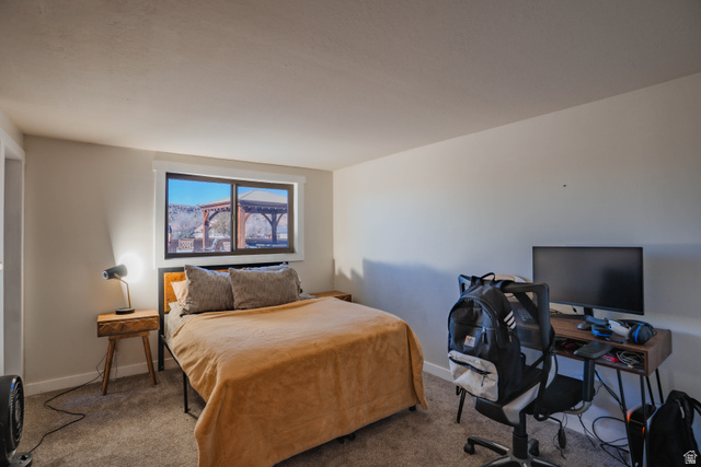 980 Cactus Circle St. George, UT 84790 - Photo 35 of 77 Bedroom featuring a desk and carpet