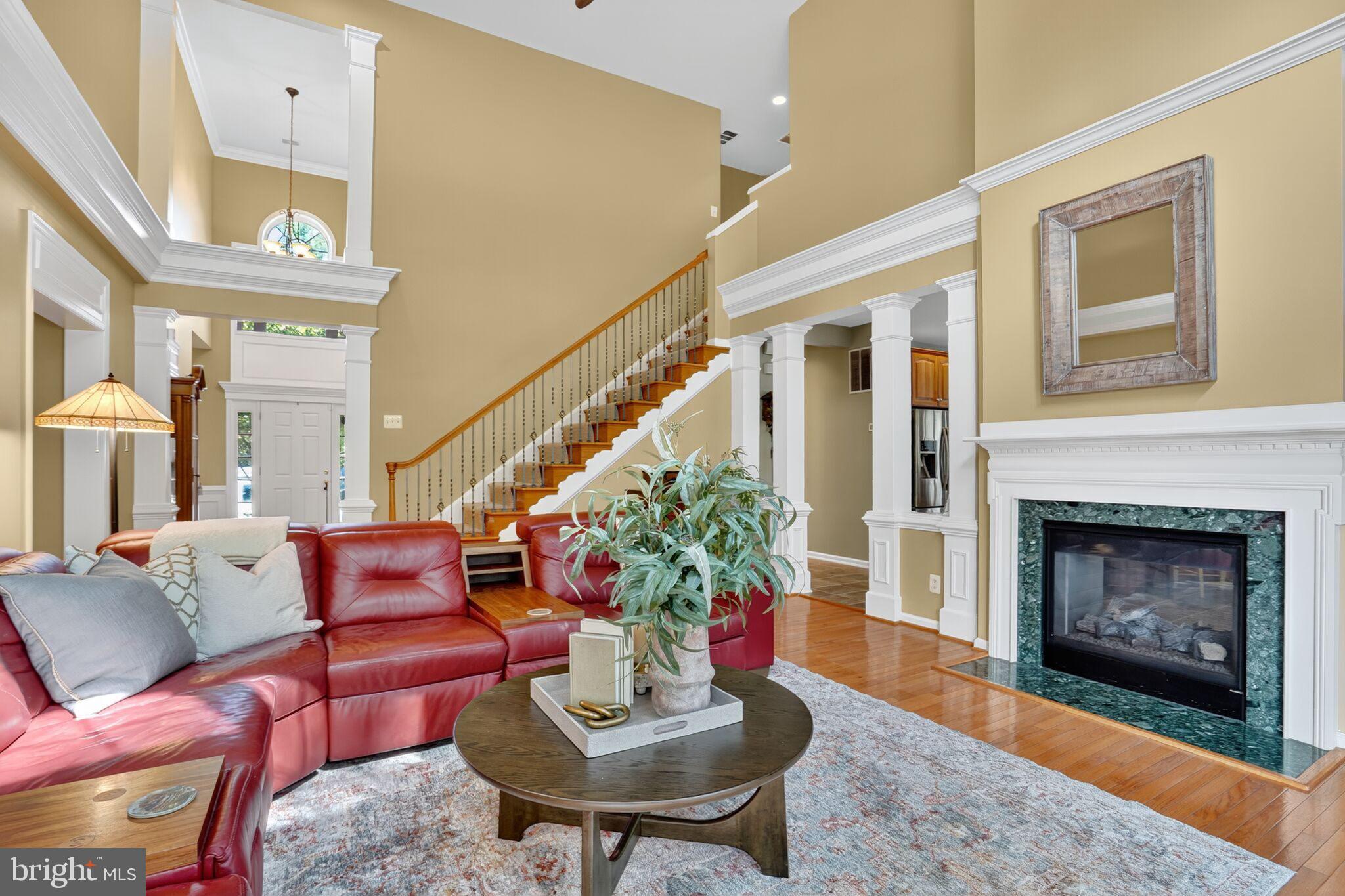 8157 American Holly Road Lorton, VA 22079 - Photo 11 of 48 a living room with furniture and a fireplace