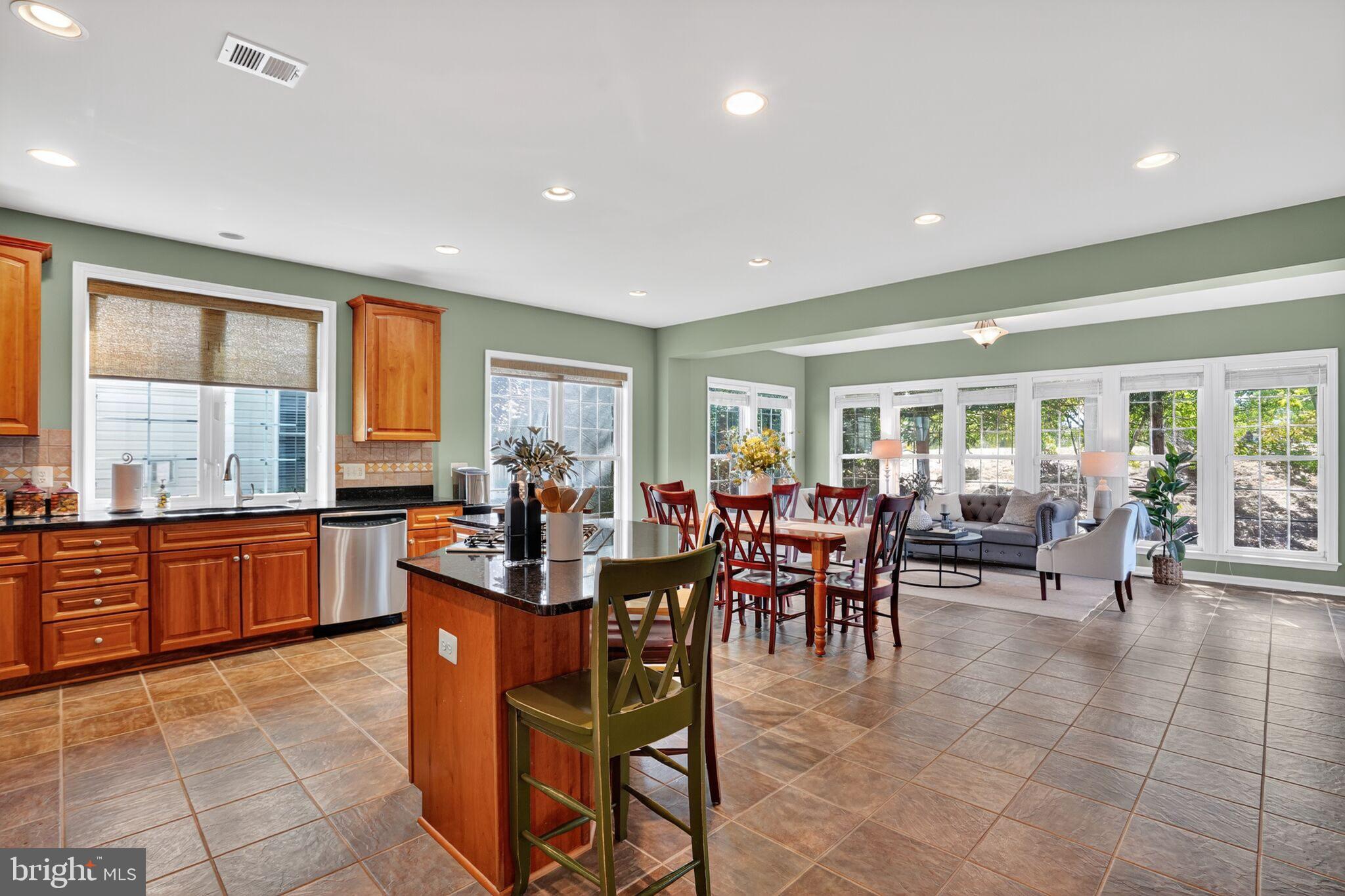 8157 American Holly Road Lorton, VA 22079 - Photo 20 of 48 a group of people sitting in a living room