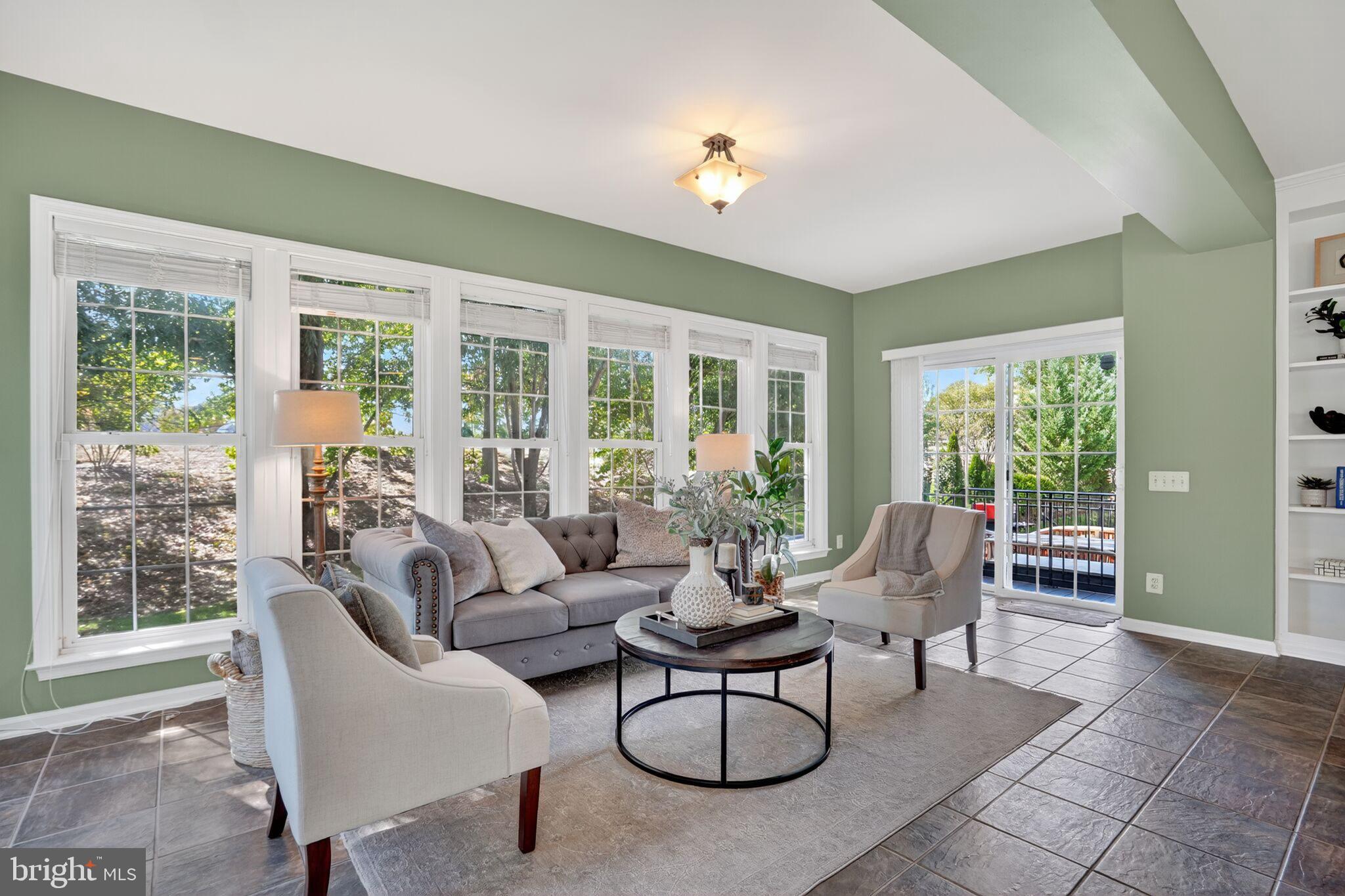 8157 American Holly Road Lorton, VA 22079 - Photo 23 of 48 a living room with furniture and floor to ceiling windows
