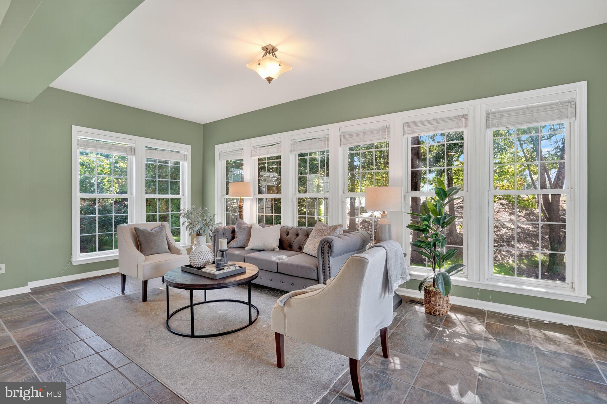 8157 American Holly Road Lorton, VA 22079 - Photo 24 of 48 a living room with furniture and floor to ceiling windows
