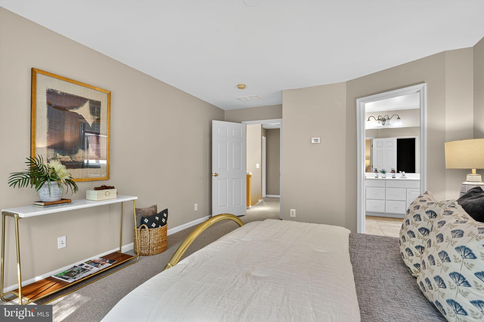 8157 American Holly Road Lorton, VA 22079 - Photo 29 of 48 a bedroom with a bed and a couch