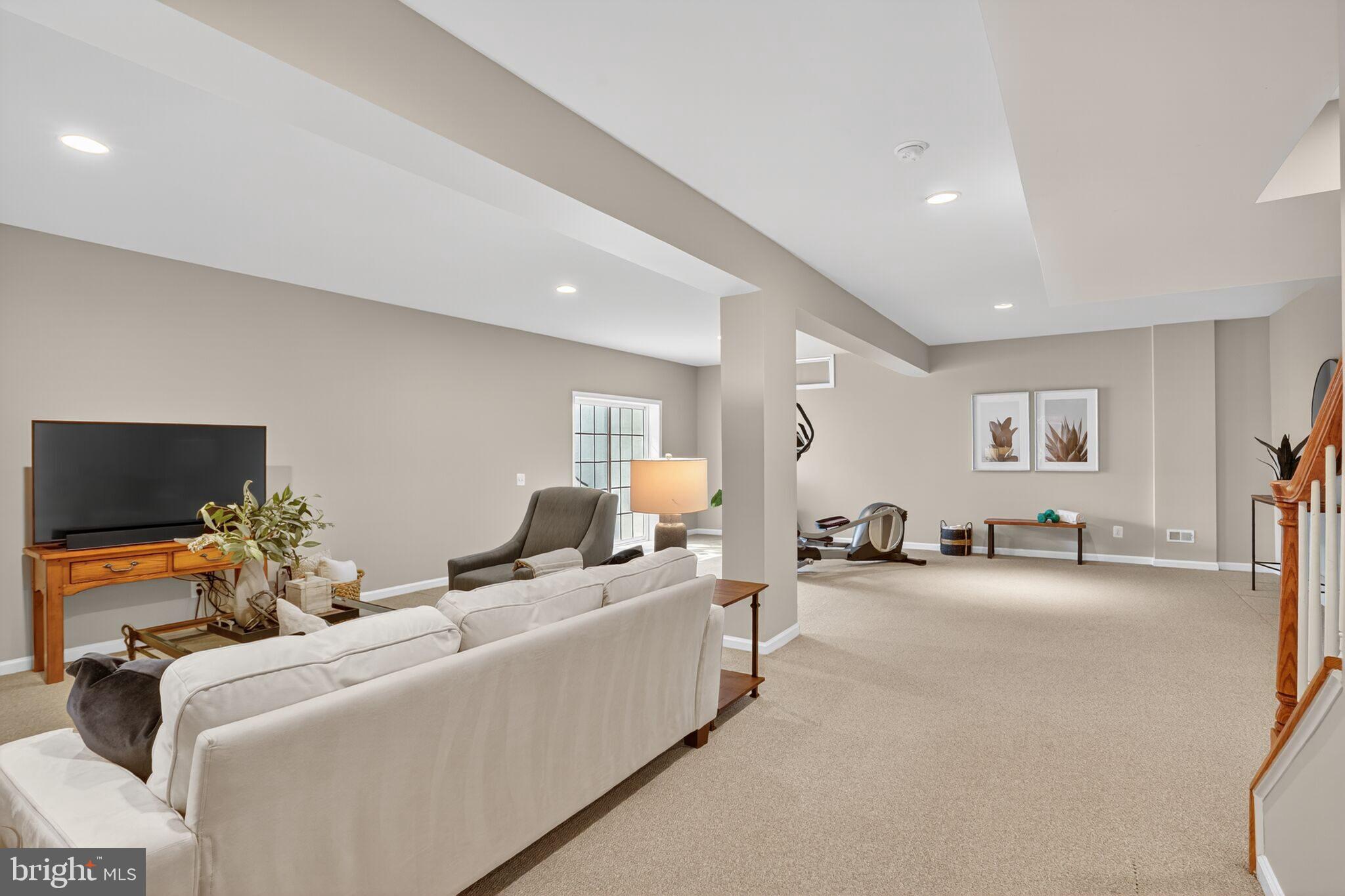 8157 American Holly Road Lorton, VA 22079 - Photo 40 of 48 a room with furniture and a flat screen tv