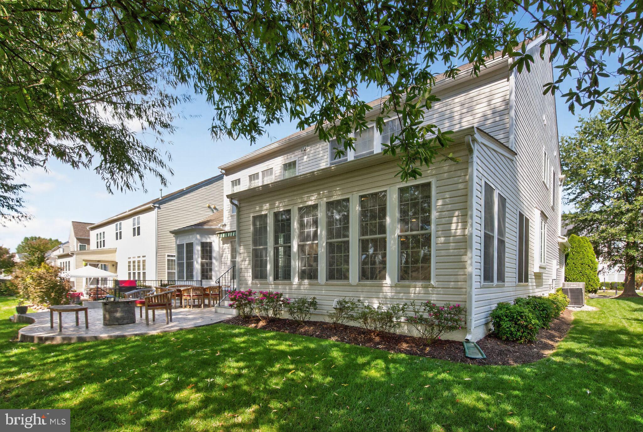 8157 American Holly Road Lorton, VA 22079 - Photo 47 of 48 a front view of a house with patio and garden