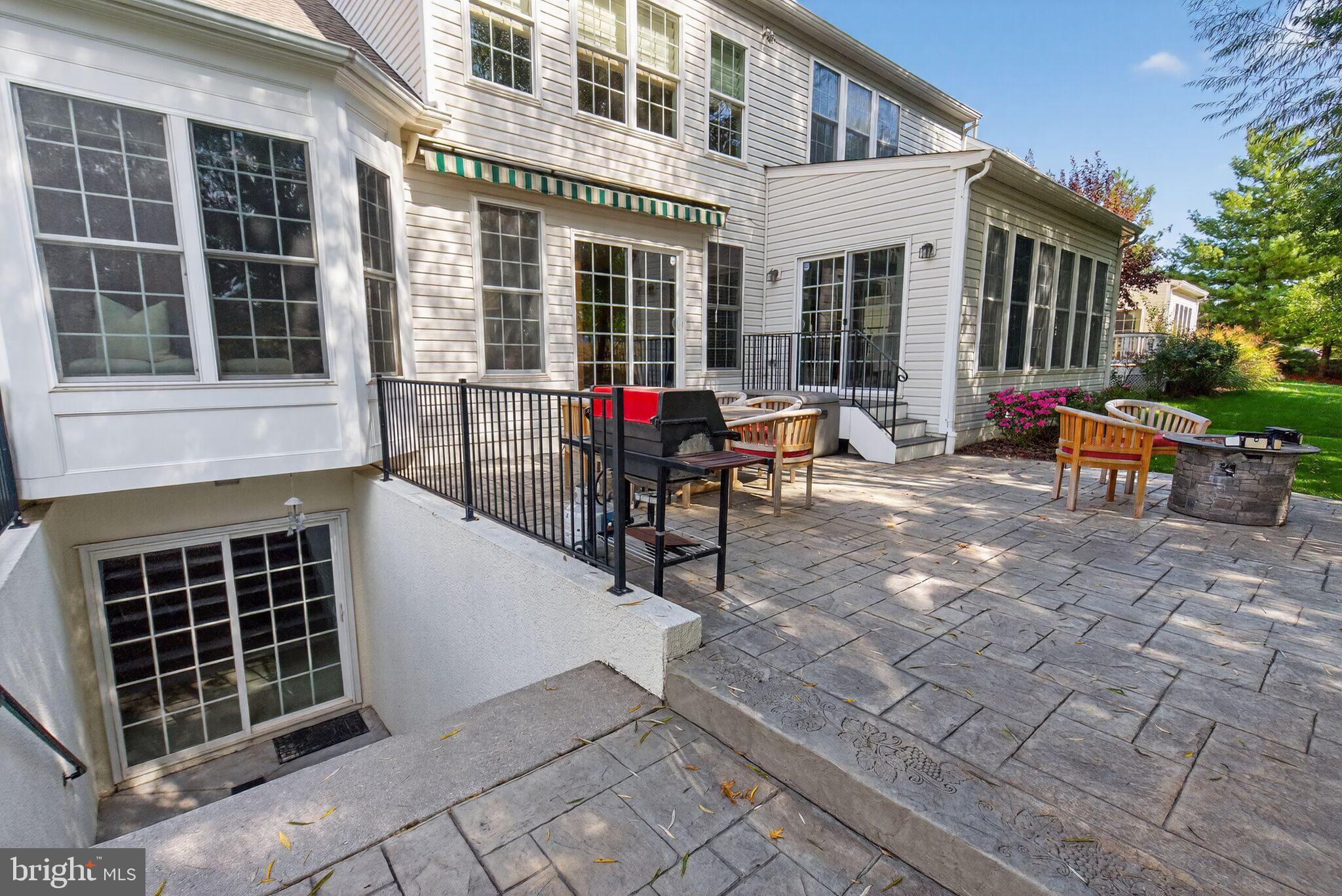 8157 American Holly Road Lorton, VA 22079 - Photo 48 of 48 a view of a house with backyard porch and sitting area