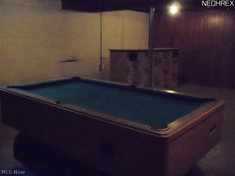 43162 Webster Road Wellington, OH 44090 - Photo 10 of 17 Pool table and portable bar in basement will stay