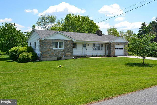 1209 Random Ridge Road Westminster, MD 21157 - Photo 2 of 12 a view of house in front of a big yard with large trees