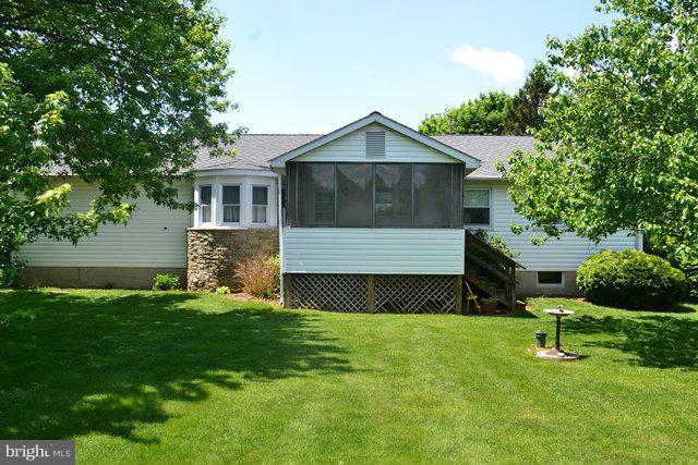 1209 Random Ridge Road Westminster, MD 21157 - Photo 3 of 12 a front view of a house with a yard