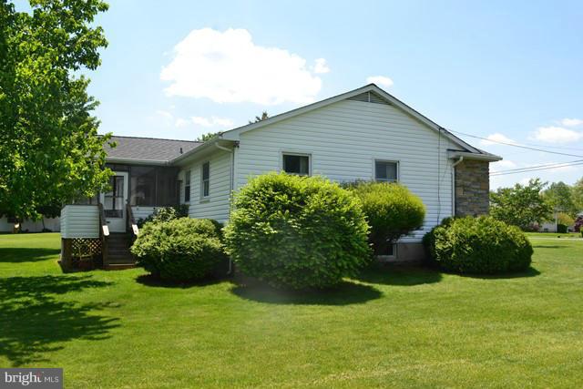 1209 Random Ridge Road Westminster, MD 21157 - Photo 4 of 12 a view of a house with a yard and plants