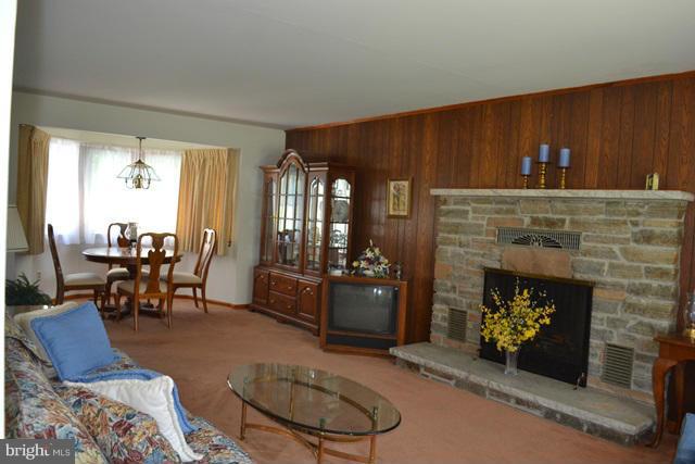 1209 Random Ridge Road Westminster, MD 21157 - Photo 5 of 12 a living room with furniture and a fireplace