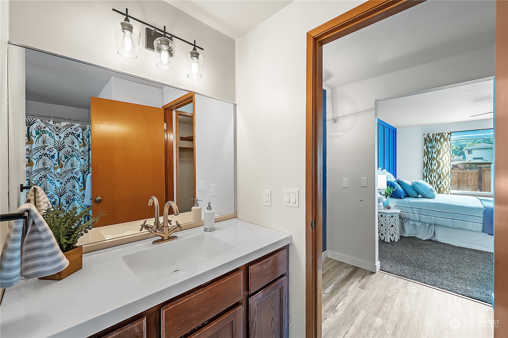 1709 24th Court Anacortes, WA 98221 - Photo 17 of 33 a bathroom with a sink a mirror and a bathtub