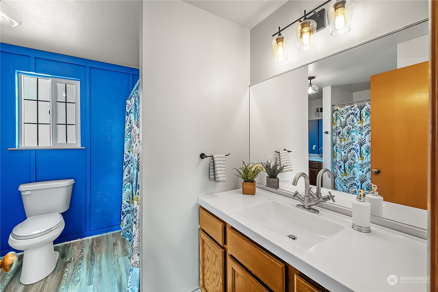 1709 24th Court Anacortes, WA 98221 - Photo 18 of 33 a bathroom with a sink a toilet and shower curtain