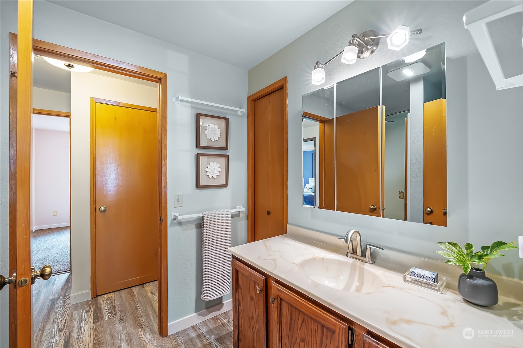 1709 24th Court Anacortes, WA 98221 - Photo 22 of 33 a bathroom with a granite countertop sink and a mirror