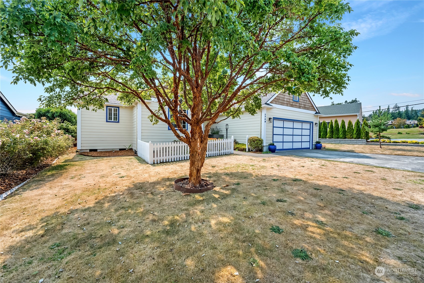 1709 24th Court Anacortes, WA 98221 - Photo 31 of 33 a view of a house with a tree in the yard