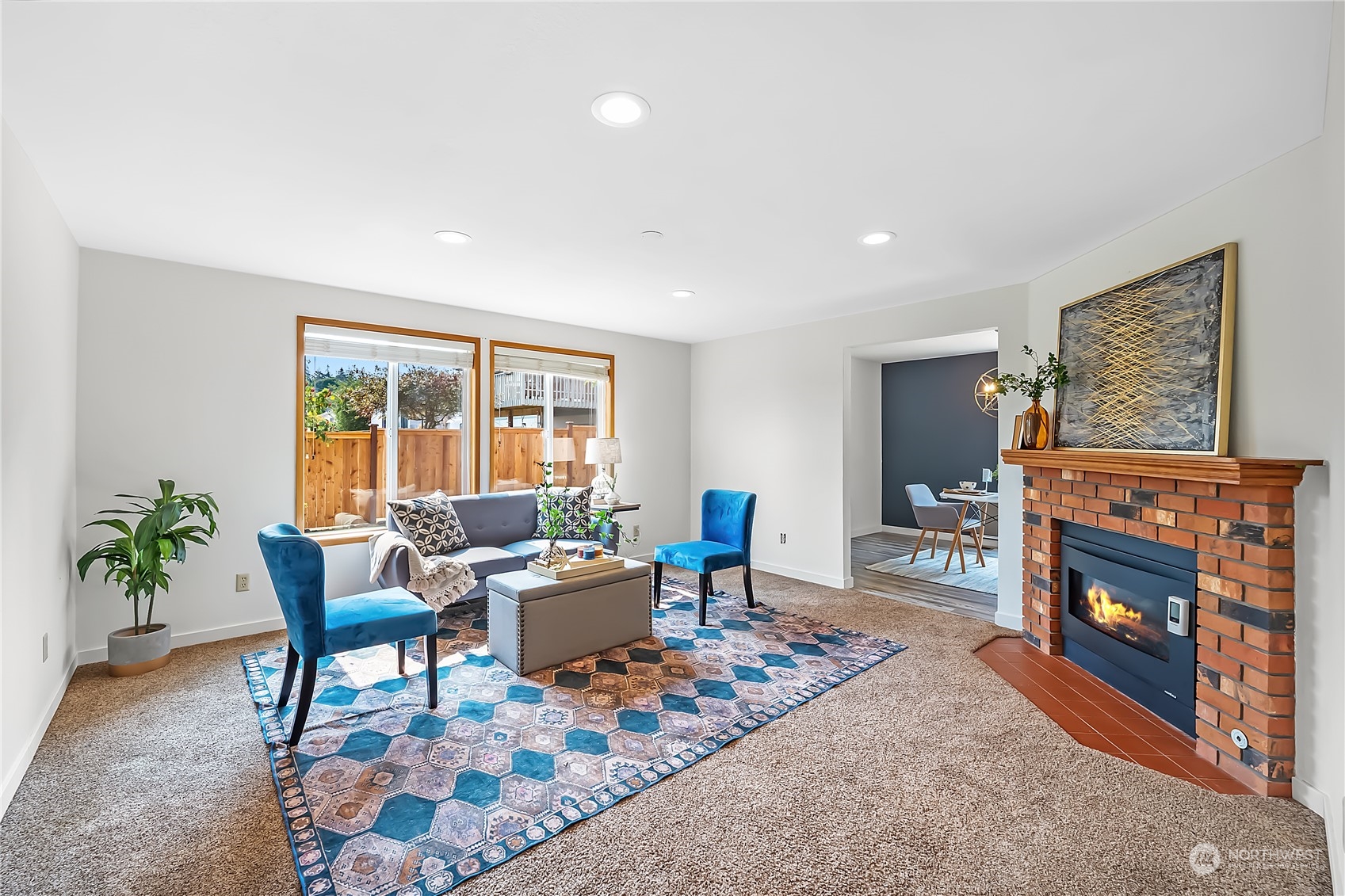 1709 24th Court Anacortes, WA 98221 - Photo 6 of 33 a living room with furniture a flat screen tv and a fireplace