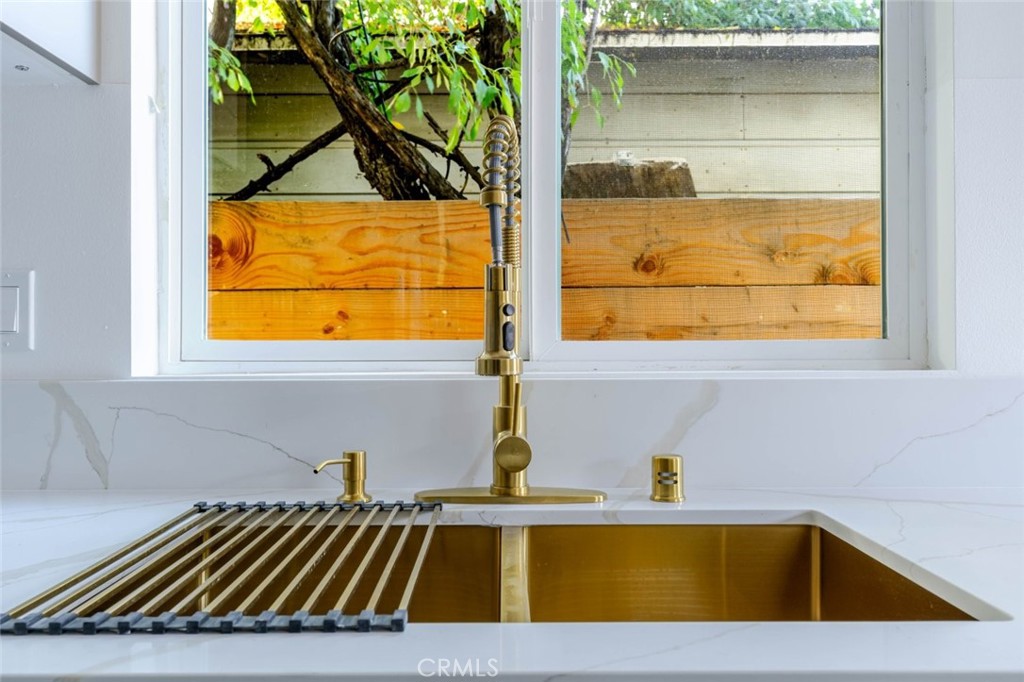 17428 Roscoe Boulevard Northridge, CA 91325 - Photo 11 of 24 a view of a sink and dishwasher with a window
