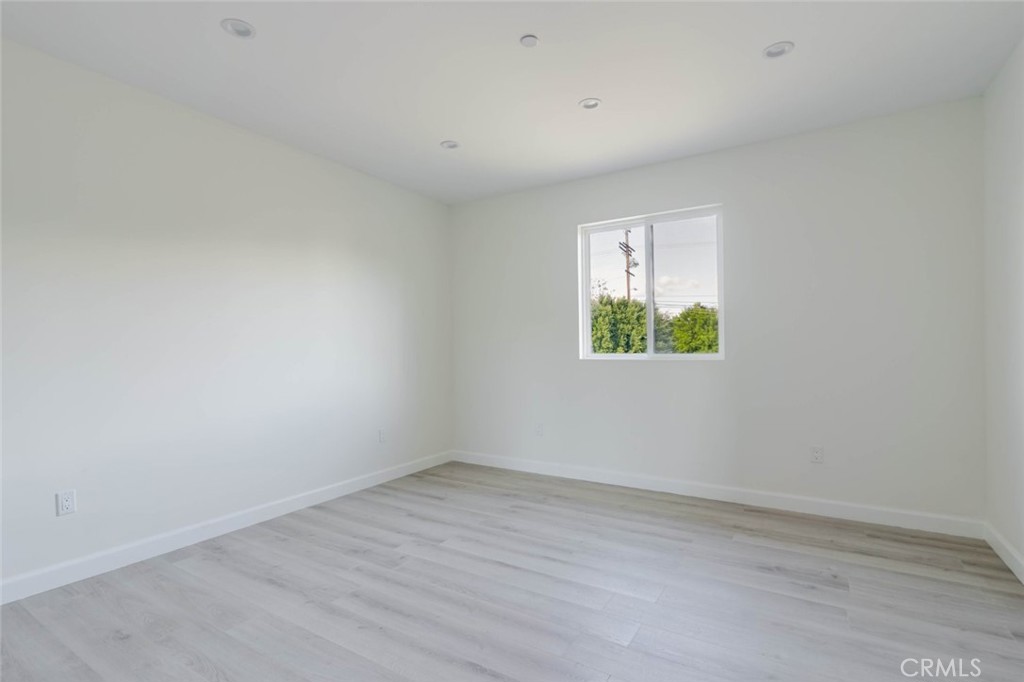 17428 Roscoe Boulevard Northridge, CA 91325 - Photo 14 of 24 an empty room with a window